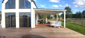 Ferienhaus Laura 70qm bis 5 Gäste mit Sauna, Whirlpool in der Hauptsaison, 75qm Terrasse und eingezäunten Garten Haustiere willkommen